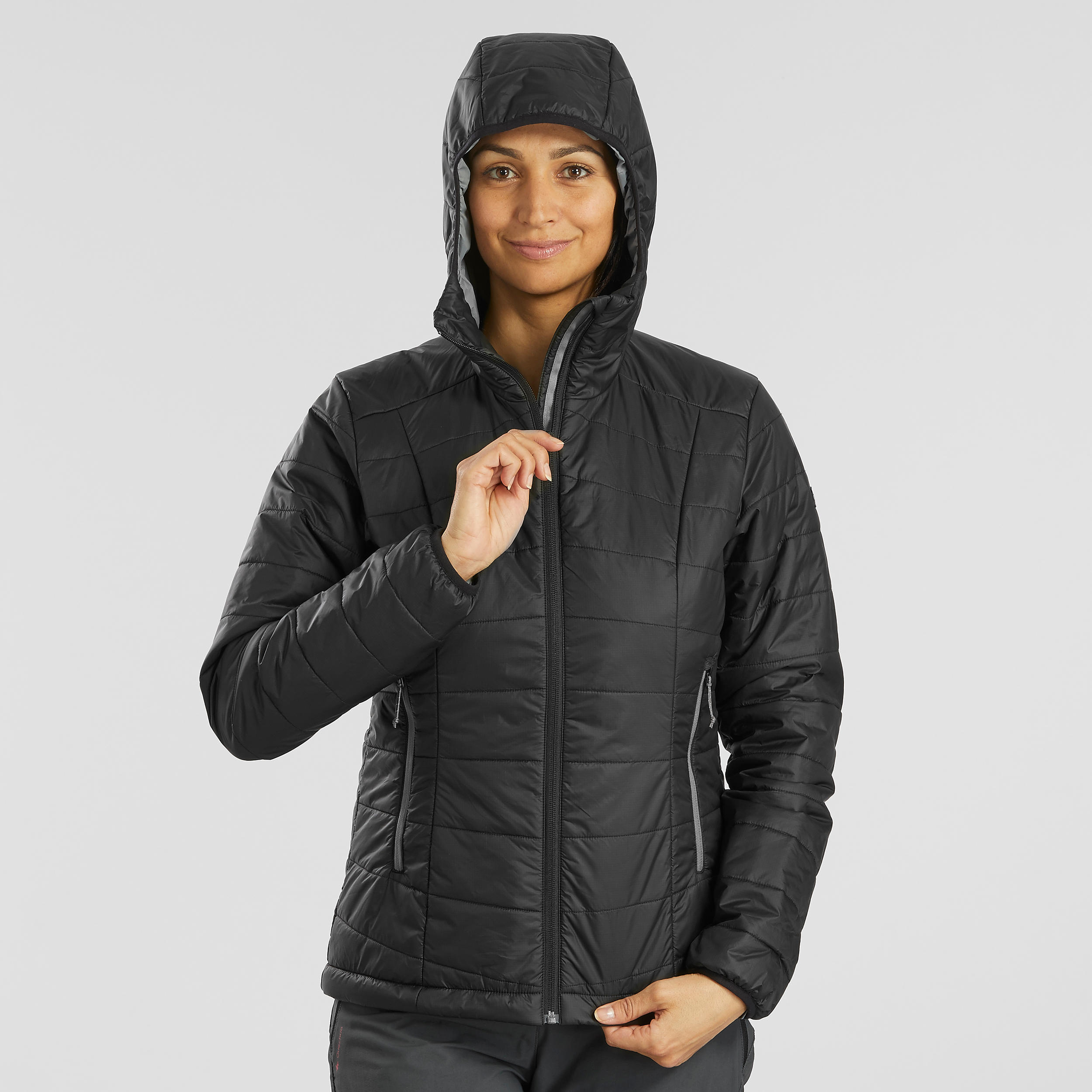 Wattierte Jacke Damen Kapuze Trekking - MT100 schwarz